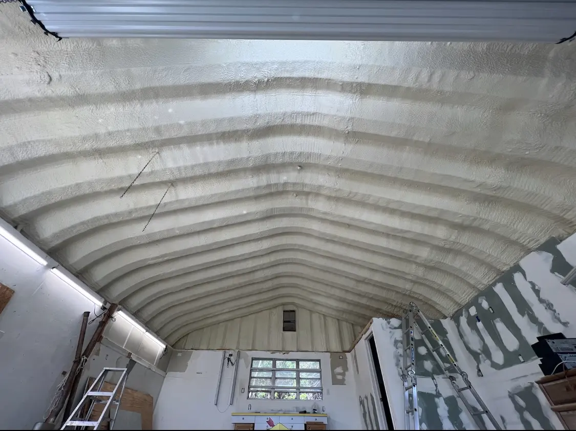 Spray polyurethane foam applied to the underside of a metal roof deck in Ocean Shores